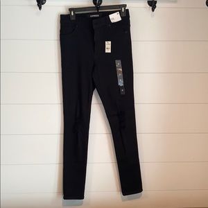 Woman’s Black high rise distressed legging